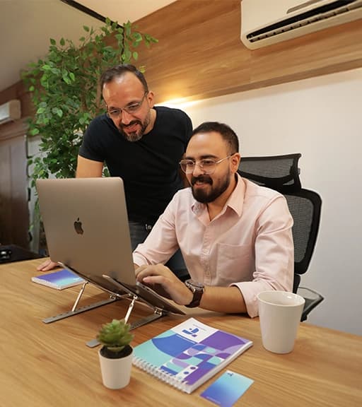 Why FlairsTech two engineers in front of a laptop
